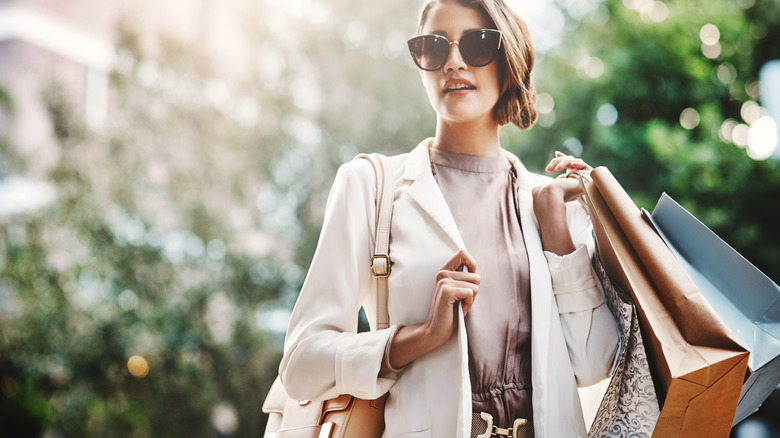 woman holding shopping bags