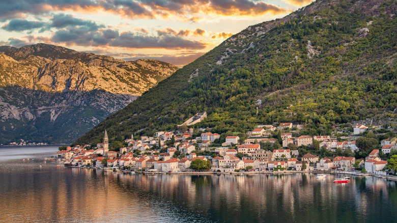 Shot of buildings on the side of a large hill at sunset in Kotor, Montenegro