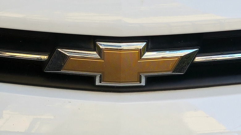 A close-up of a Chevy logo.