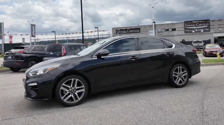 A Black 2020 Kia Forte EX Premium on a dealership's lot