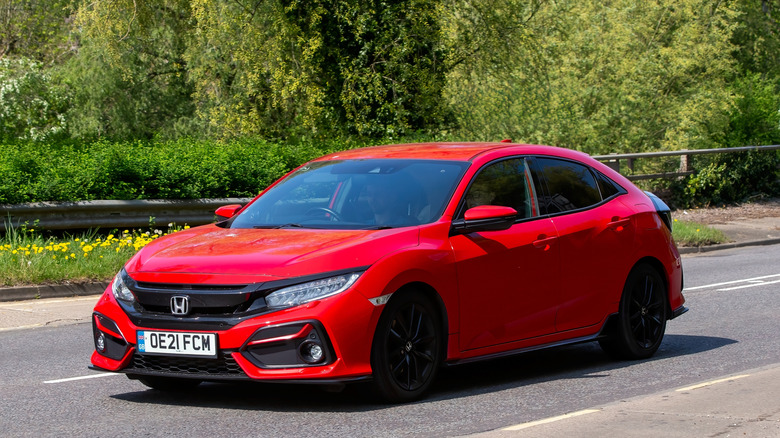 2021 red Honda Civic sport car on an English road.