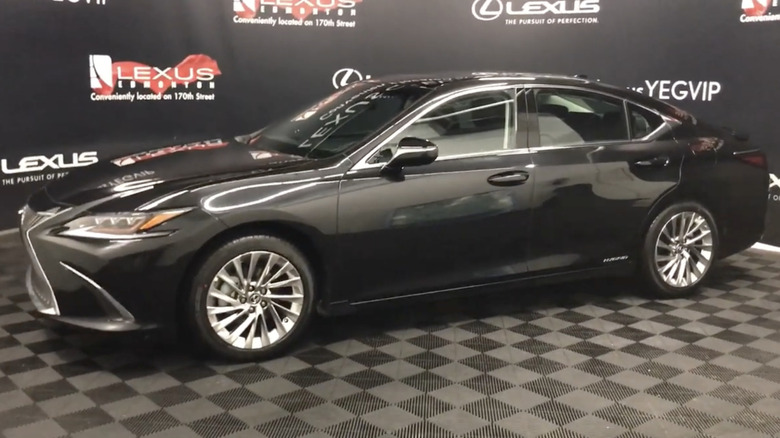 A black 2021 Lexus ES 300H on display at a dealership
