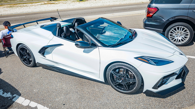 High perspective front corner view of a 2022 Chevrolet Corvette 2LT Convertible at a local car show.
