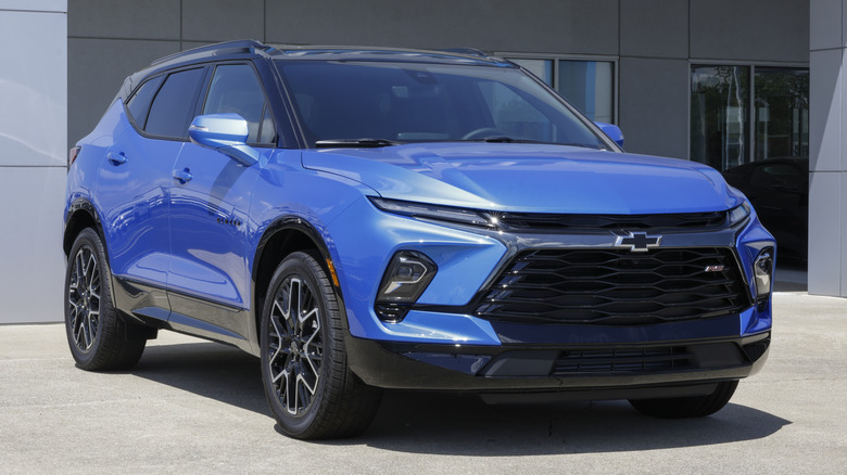 A blue Chevrolet Blazer RS AWD SUV at a dealership