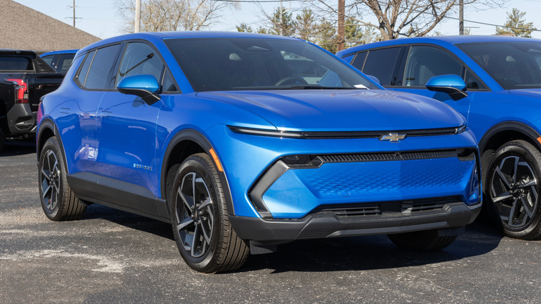 A blue Chevrolet Equinox EV LT Electric SUV at a dealership