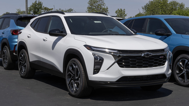 A white Chevrolet Trax 2RS Compact SUV display at a dealership