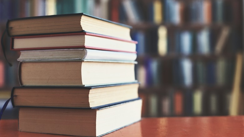 a stack of books on table