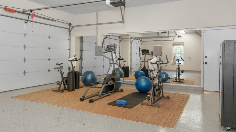 A garage full of various types of exercise equipment