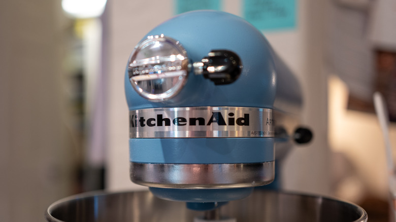 Front view of a light blue KitchenAid mixer with the brand name visible