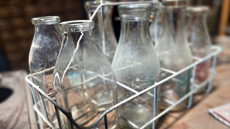 Glass milk bottles in a metal tray