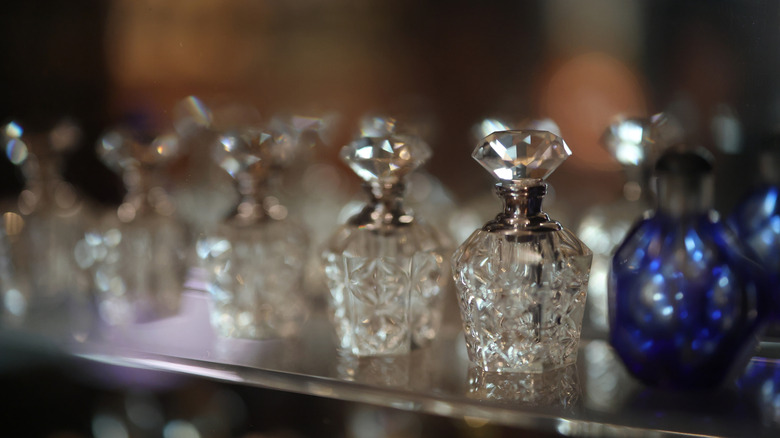 Vintage glass perfume bottles on display.