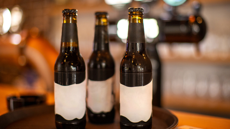 three small bottles of syrup