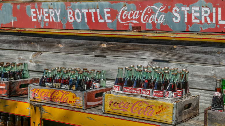 Vintage bottles of Coca-Cola on display.