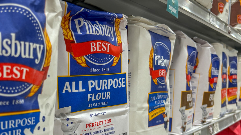 A store shelf lined with Pillsbury all-purpose flour