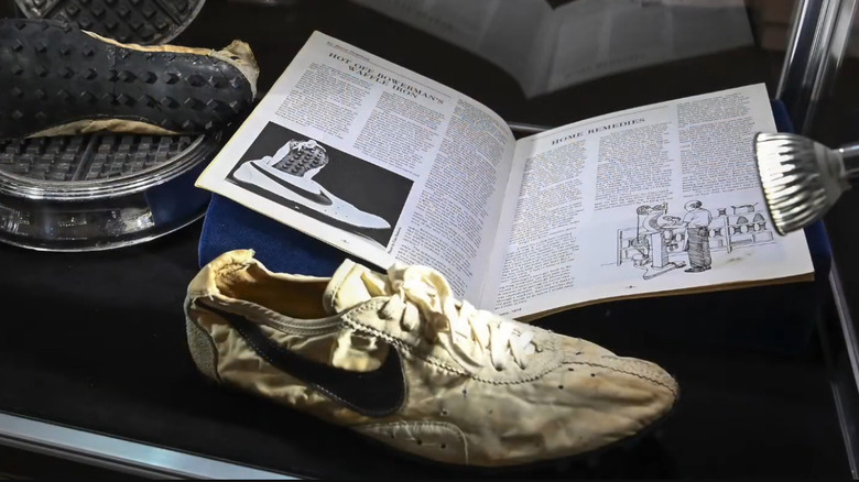 Display case featuring the Nike Waffle Flat Moon shoe