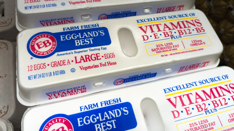 Close up of row of Eggland's Best eggs in labeled containers