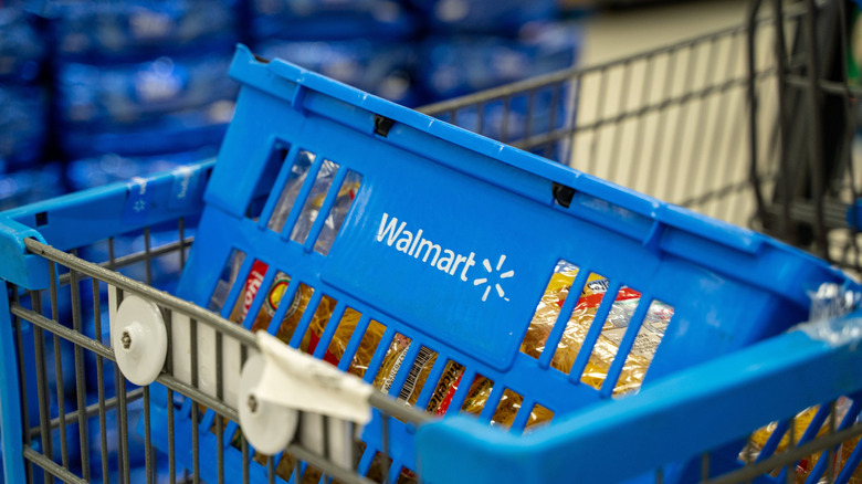 A Walmart grocery basket inside a shopping cart