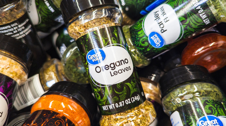 Great Value spices with container of oregano leaves on top