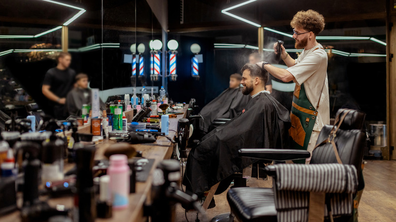 a barber cutting hair