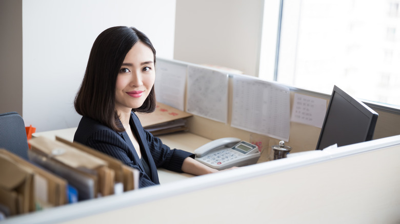 administrative support worker in cubicle