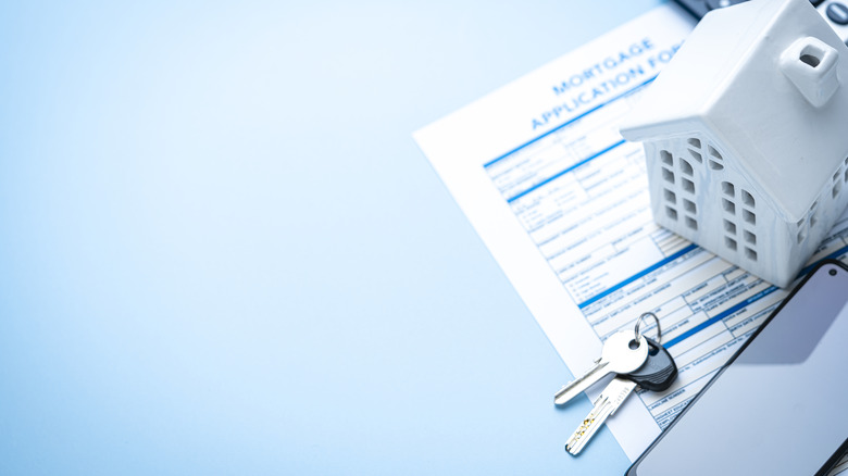 home loan document and a house figurine