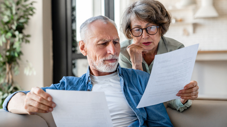 older couple looking at financial documents