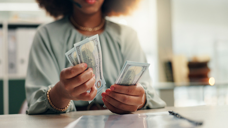 woman counting cash
