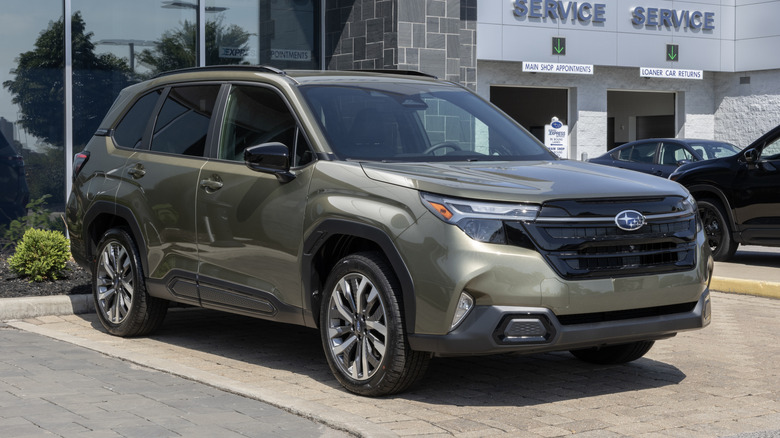 Subaru Forester Touring Compact SUV at a dealership.