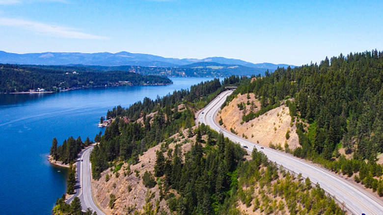 Aerial view of highway alongside cliff beside river near Coeur d'Alene