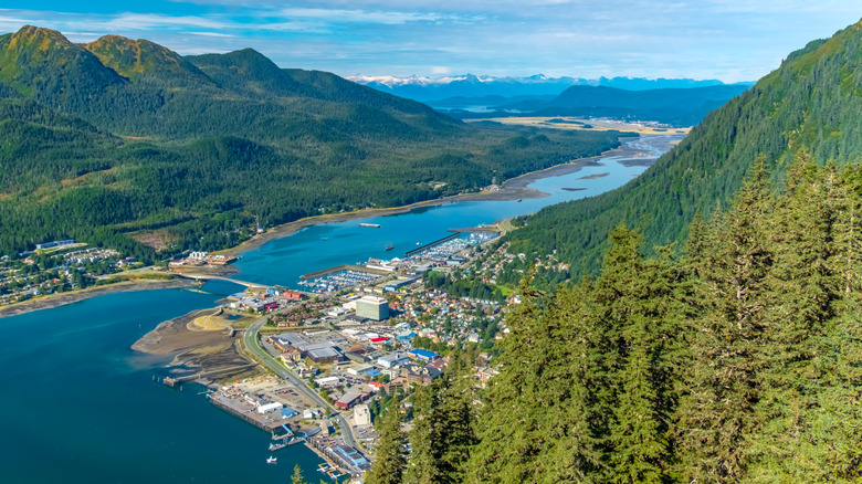 Aerial view of the city of Juneau near river and surrounded by mountains