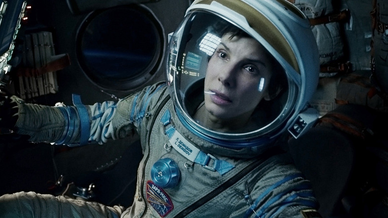 Still of Sandra Bullock in intense space scene in the movie "Gravity"