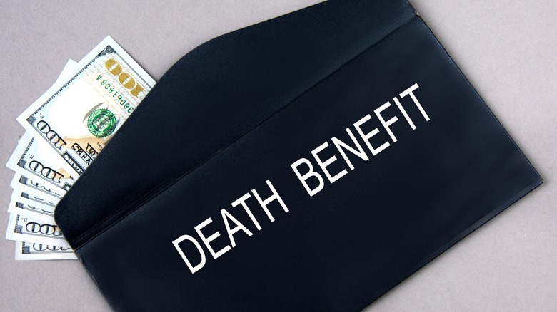DEATH BENEFIT - words on a black envelope with banknotes.