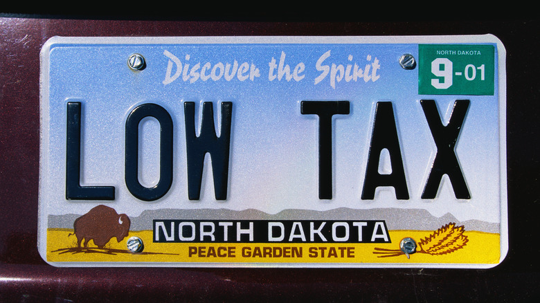 North Dakota license plate with words "Low Tax" written on it