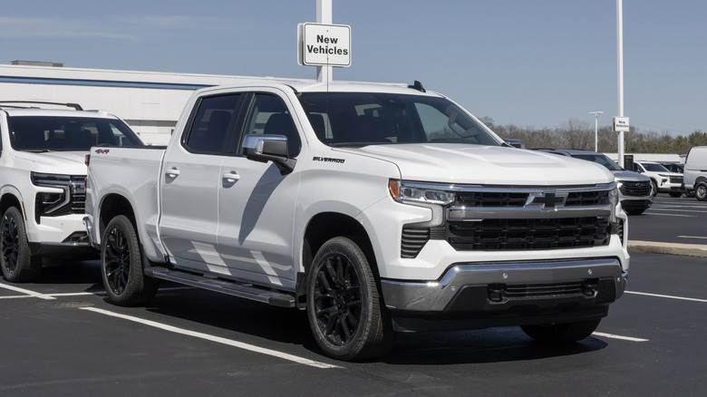 A Chevrolet Silverado 1500 Crew LT 4WD parked at a dealership.