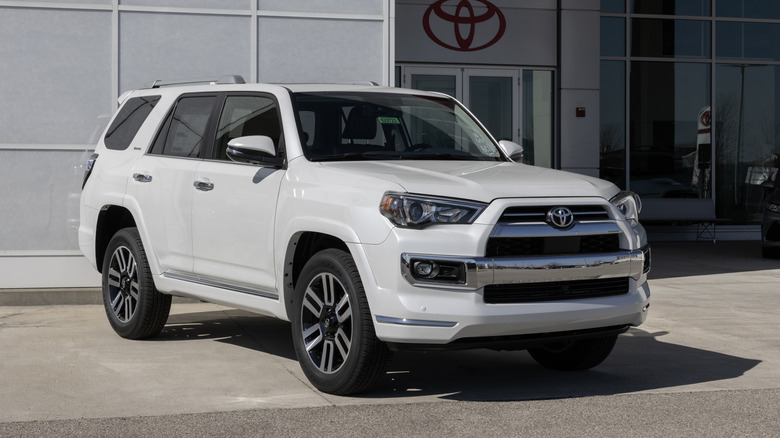 A white Toyota 4Runner Limited display at a dealership.