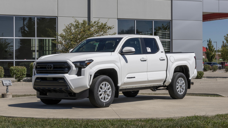 A display of a Toyota Tacoma SR5 4X4 Double Cab at a dealership.