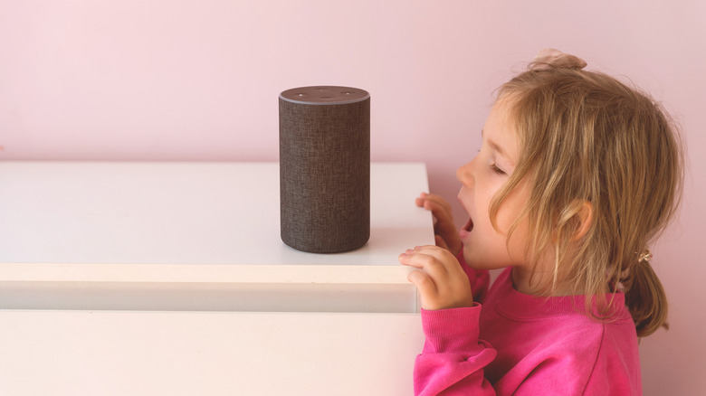 a kid talking to an Echo device