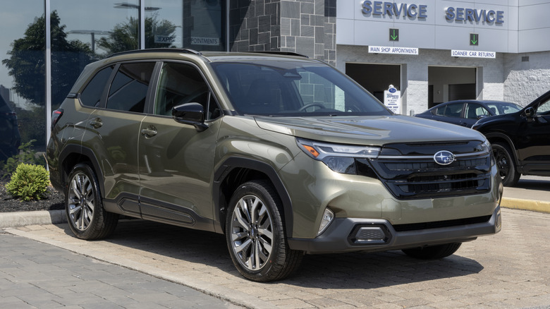 Subaru Forester Touring Compact SUV at a dealership.