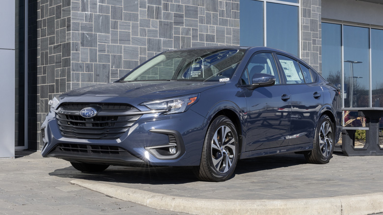 Subaru Legacy Premium SUV display at a dealership.