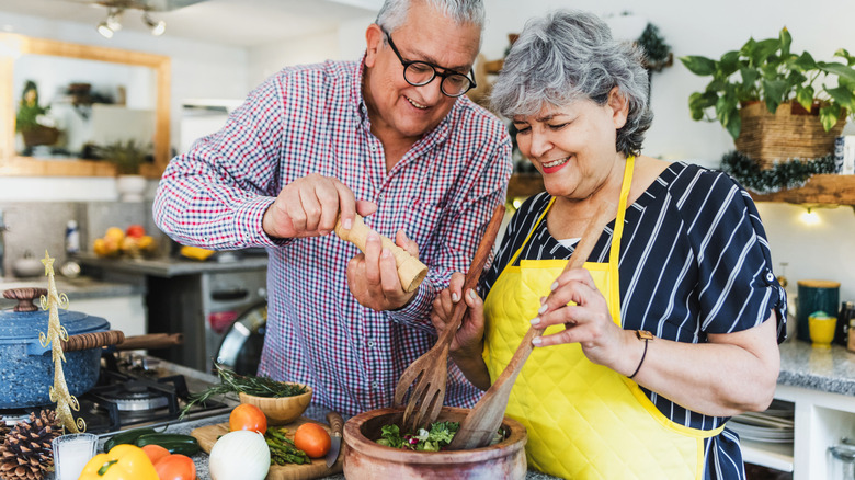 older couple cooking together