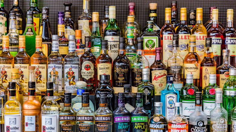 dozens of colorful bottles of liquor