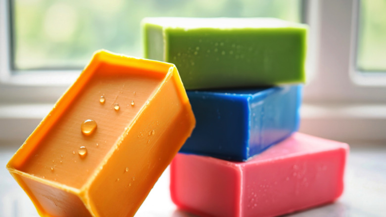 colorful bars of soap near a window