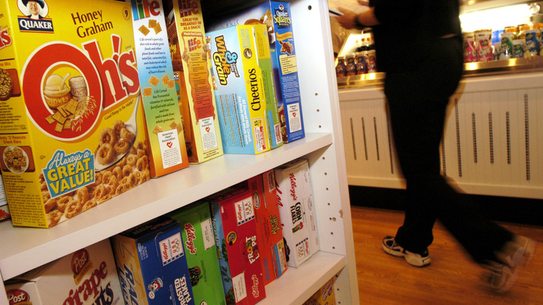 customer walks passed boxes of cereal
