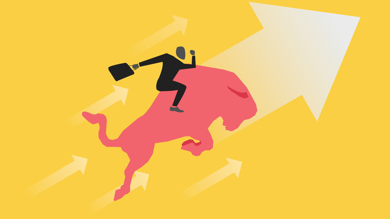 image of an investor riding a bull upward