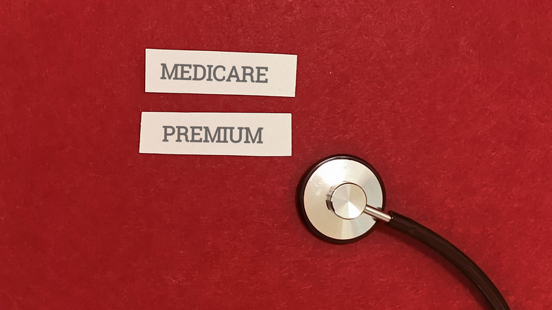 medicare premium on paper next to stethescope