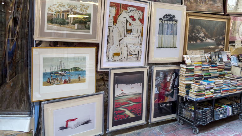 Collection of artwork displayed at a local outdoor flea market