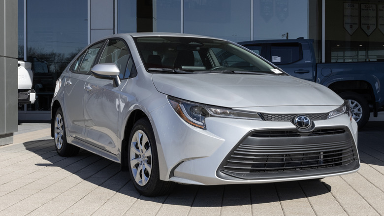 The Toyota Corolla LE compact sedan display at a dealership.