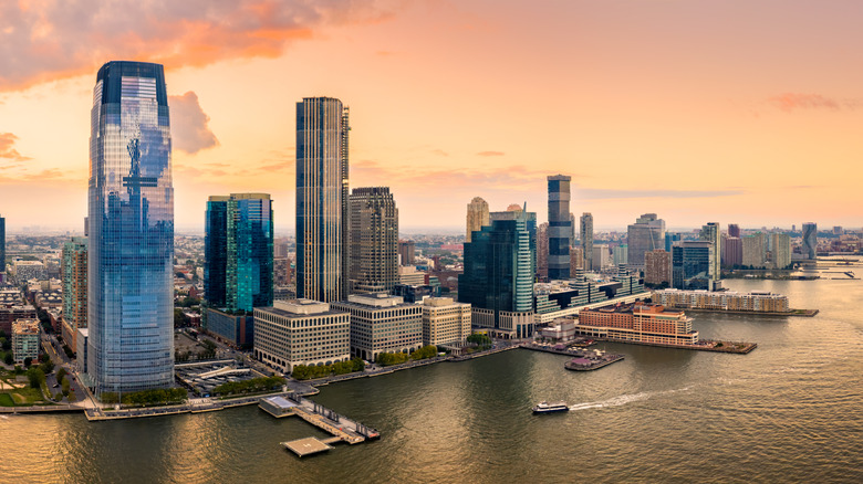 Aerial panorama of Jersey City skyline at sunset.