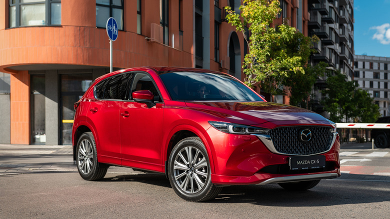 A new Mazda CX-5 on the street of a residential district.