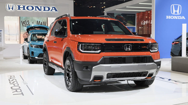 An orange 2026 Honda Passport is on display during the 2024 LA Auto Show.